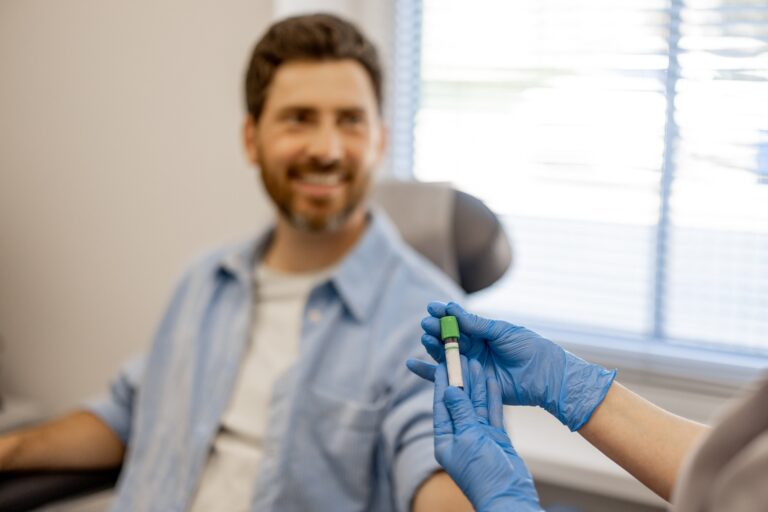 Man gives blood for tests in laboartory