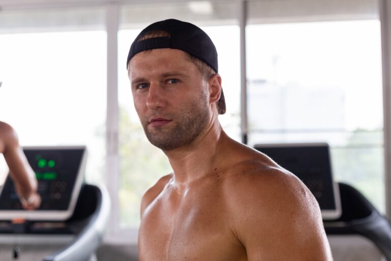 Portrait of confident muscular man looking at camera